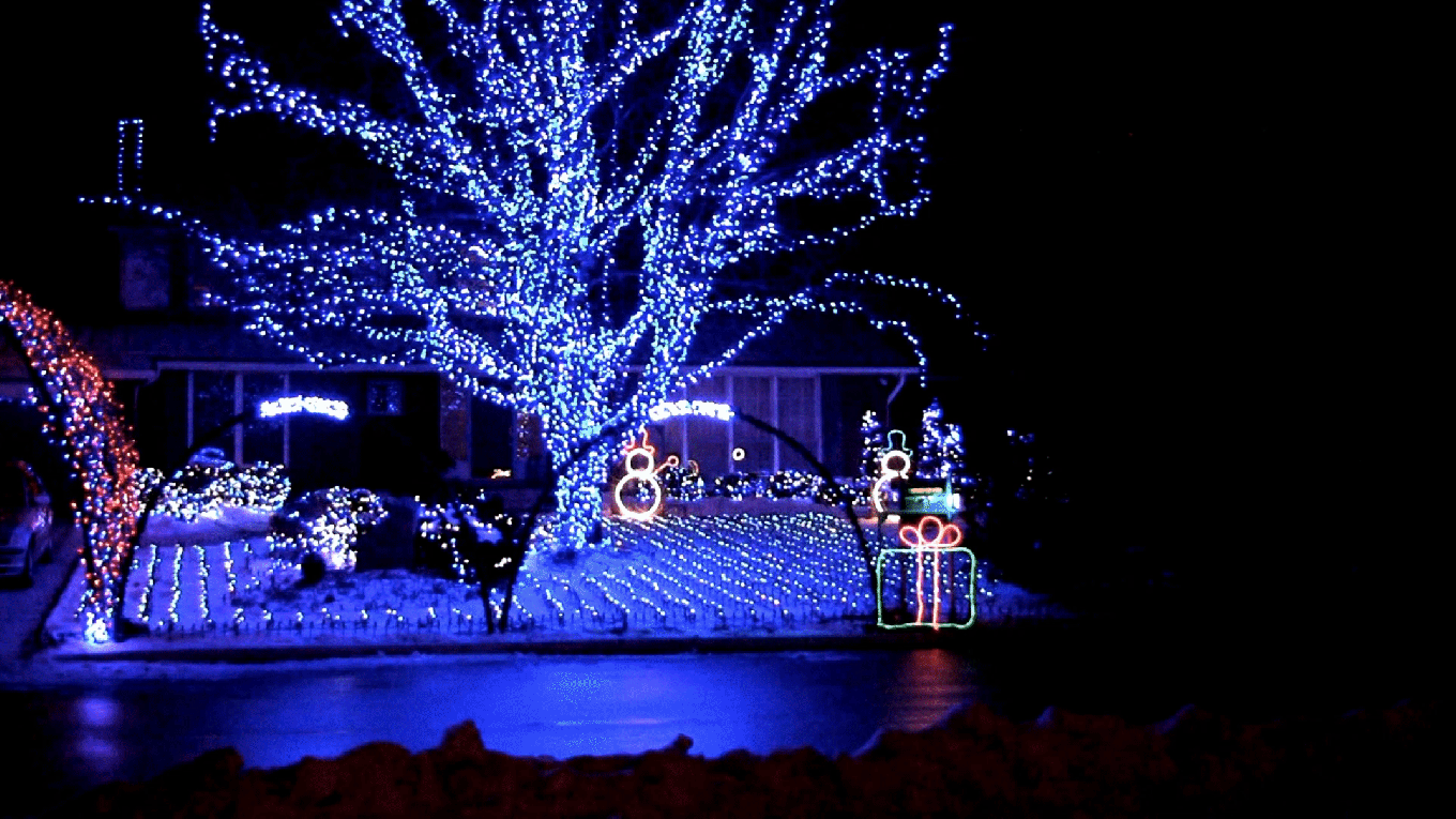 A house with a high-tech, smart-enabled light display for Christmas serves as an example of the Techie decorating style.