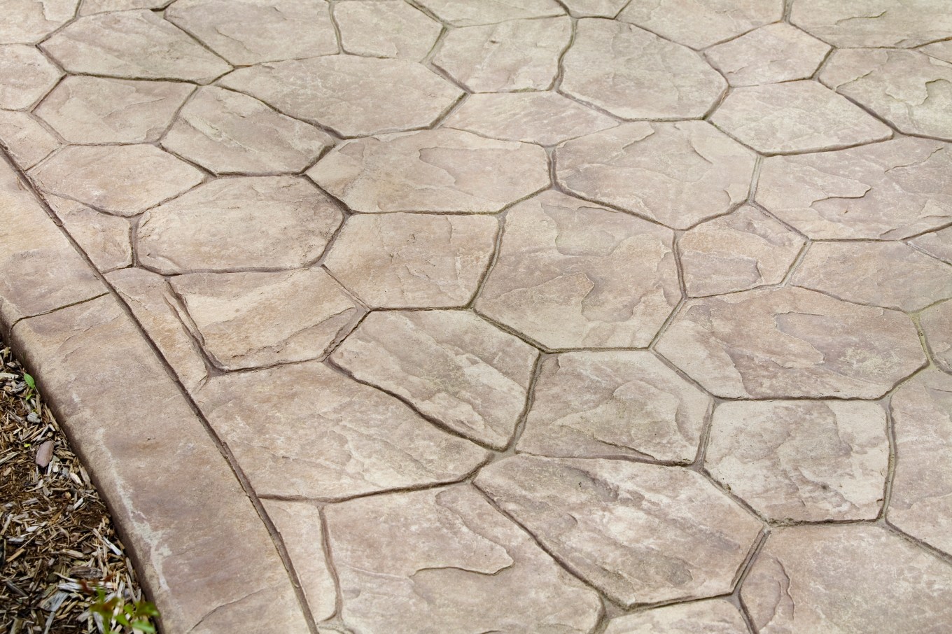 Stamped concrete patio that resembles stone.