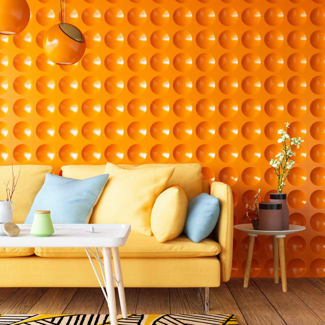 A colorful sofa with a vibrant orange wall is a good example of what's in when it comes to interior design for 2024.