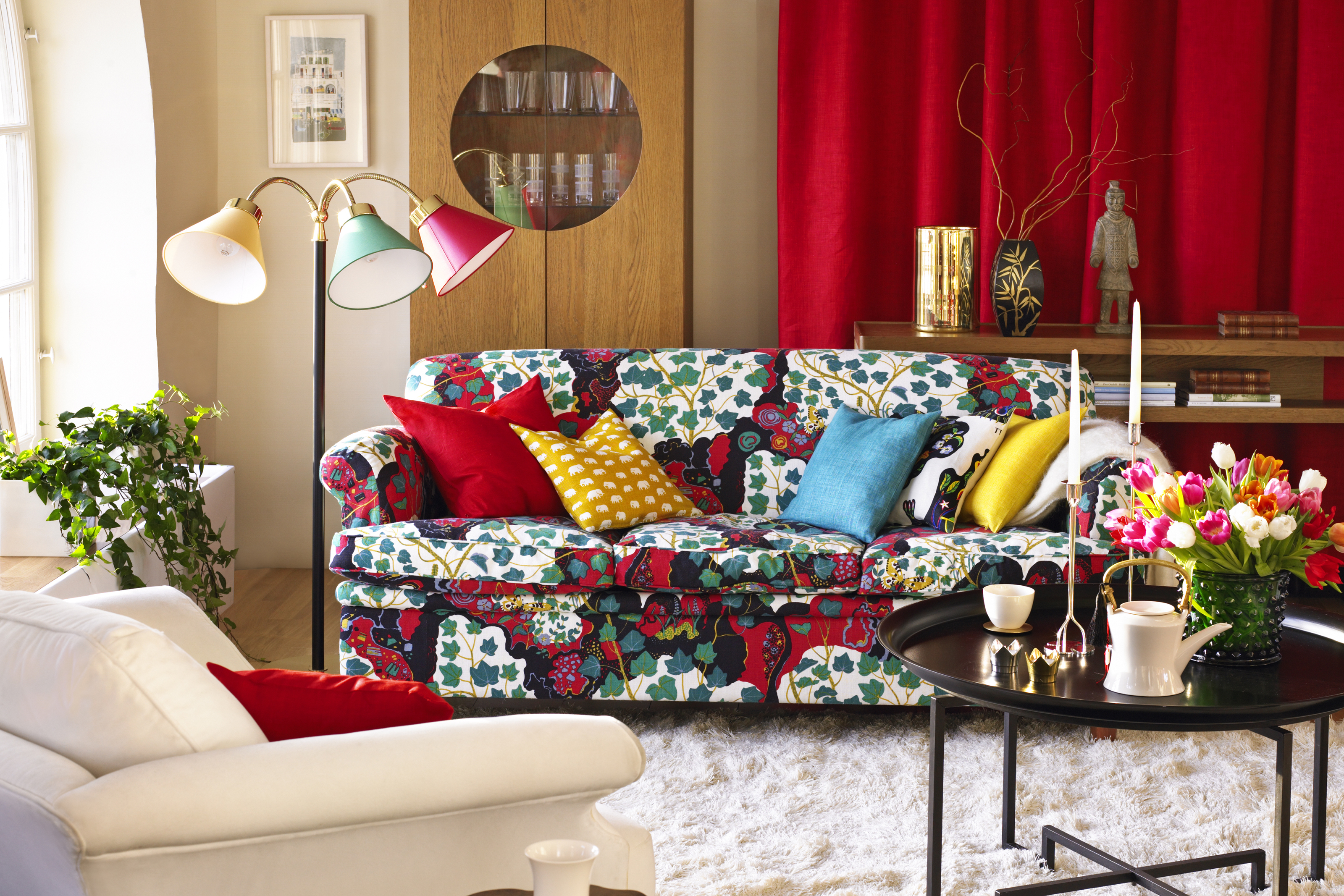 A colorful eclectic living room filled with personal touches.