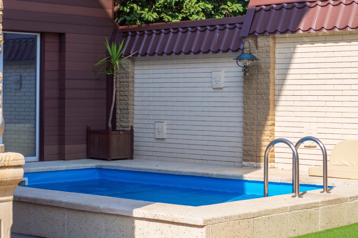 An in-ground plunge pool nestled in a secluded courtyard.