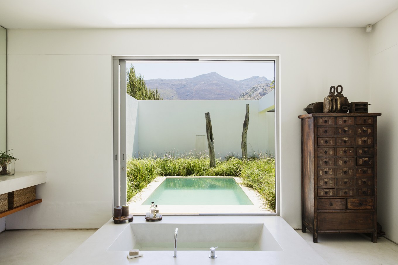 A modern bathroom overlooking a luxury plunge pool