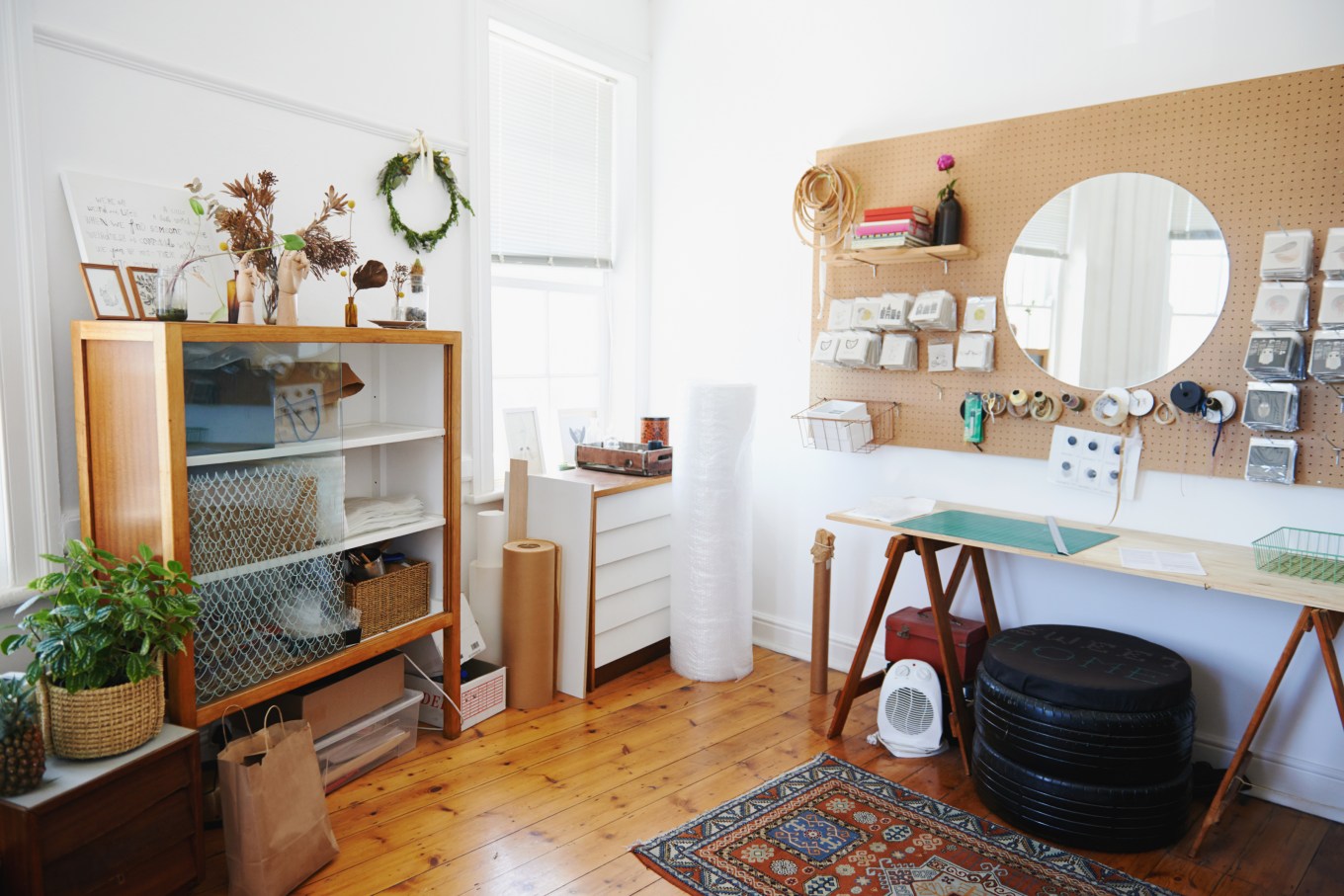 An example of a good craft room set up with a table and drawer space for crafts or hobbies.