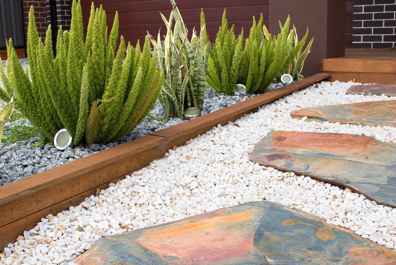 Awesome front yard design, combination of plants, paving and pebble