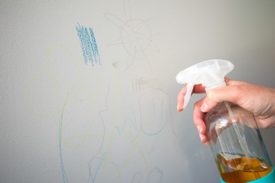 A bottle to spray Goo Gone on a wall to remove the crayon drawn on it.