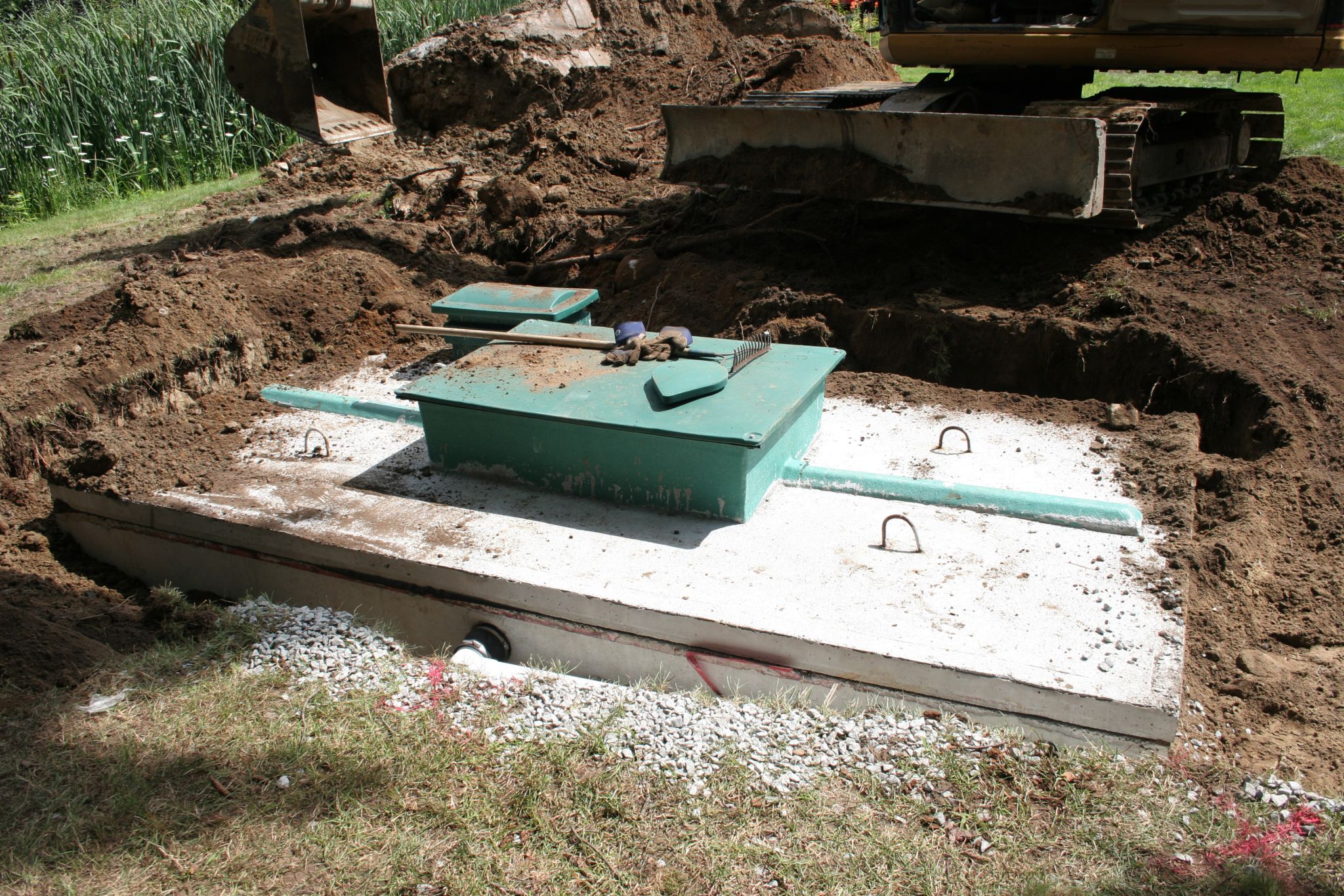 A septic system being constructed with a concrete wastewater reservoir.