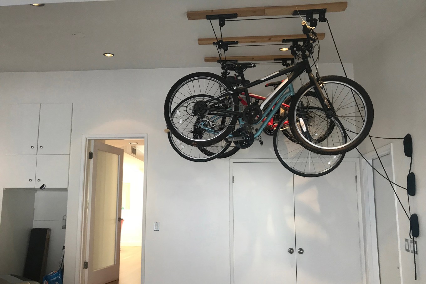 A bike storage option on the roof of a garage.