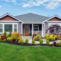 A colorful, modern single-level home exemplifying what can be done with exterior paint.