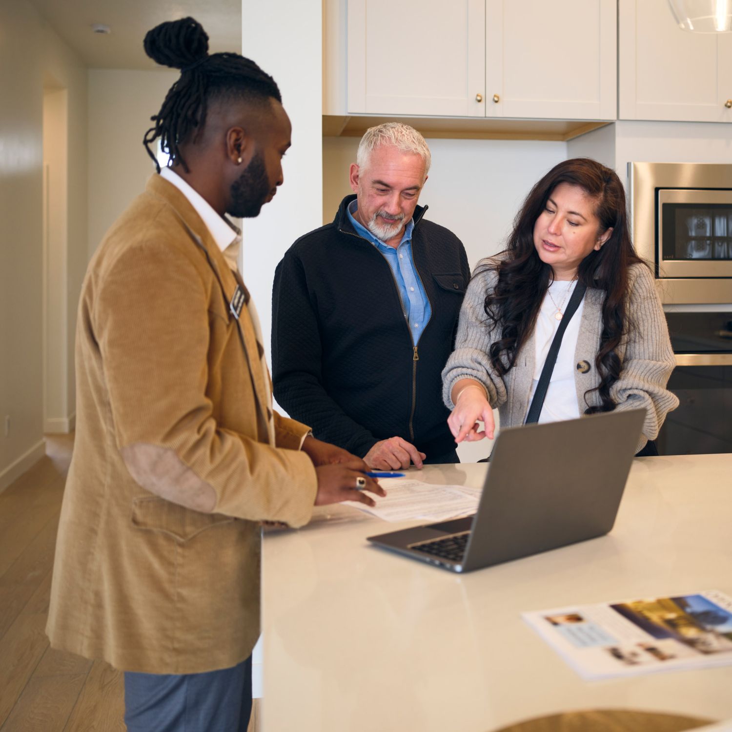 A professional real estate agent, showing homeowners comps of their house and helping them understand how to price their home.