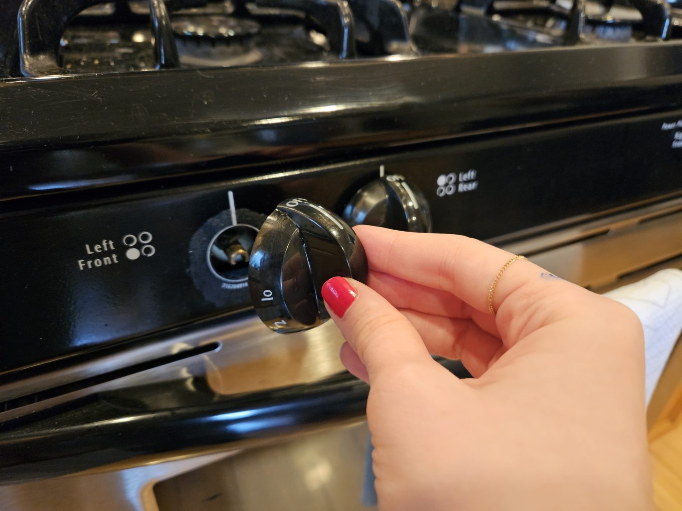 A stove knob with grime under it.