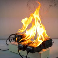 An electrical fire burning on adapters plugged in.