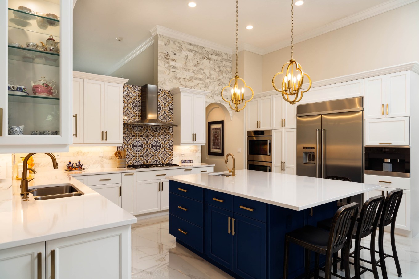 Beautiful luxury home kitchen with white cabinets, highlighting some desired features.