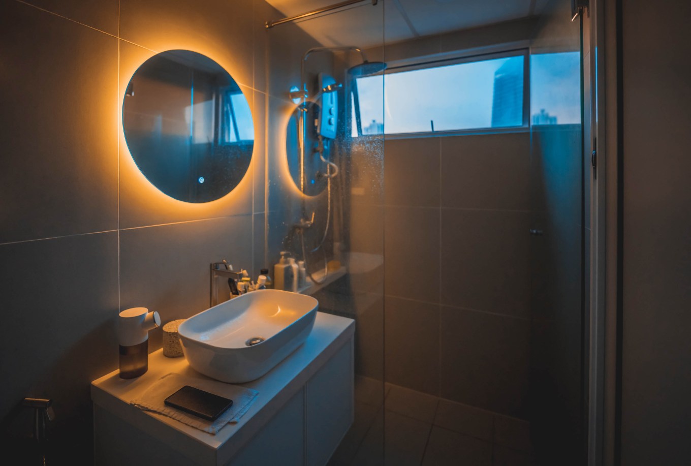 An interior of a bathroom with some cozy lighting to accent the bathroom.