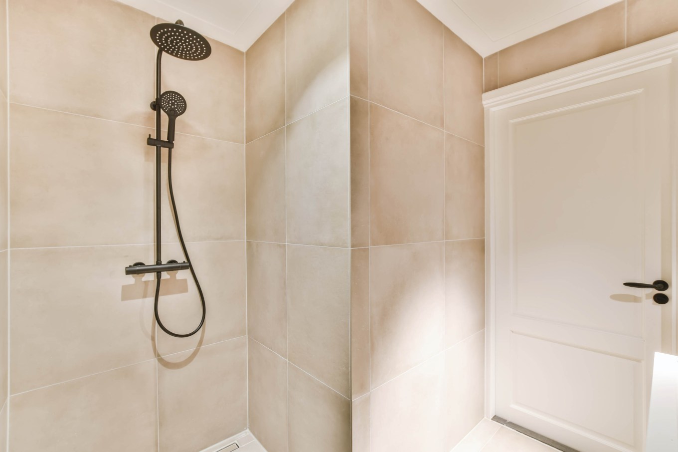 An interior shot of a bathroom with a low maintenance shower.