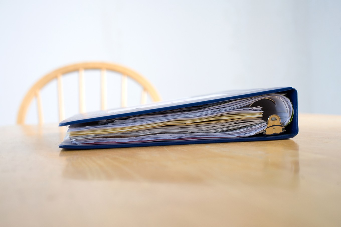 A binder filled with home maintenance records.