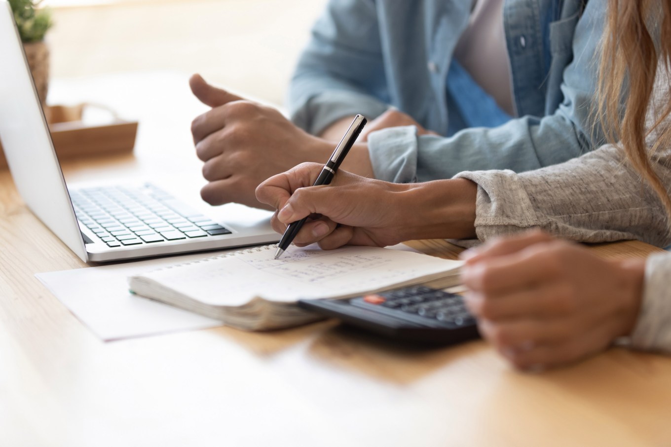 A couple tracking home maintenance expenses for their house.