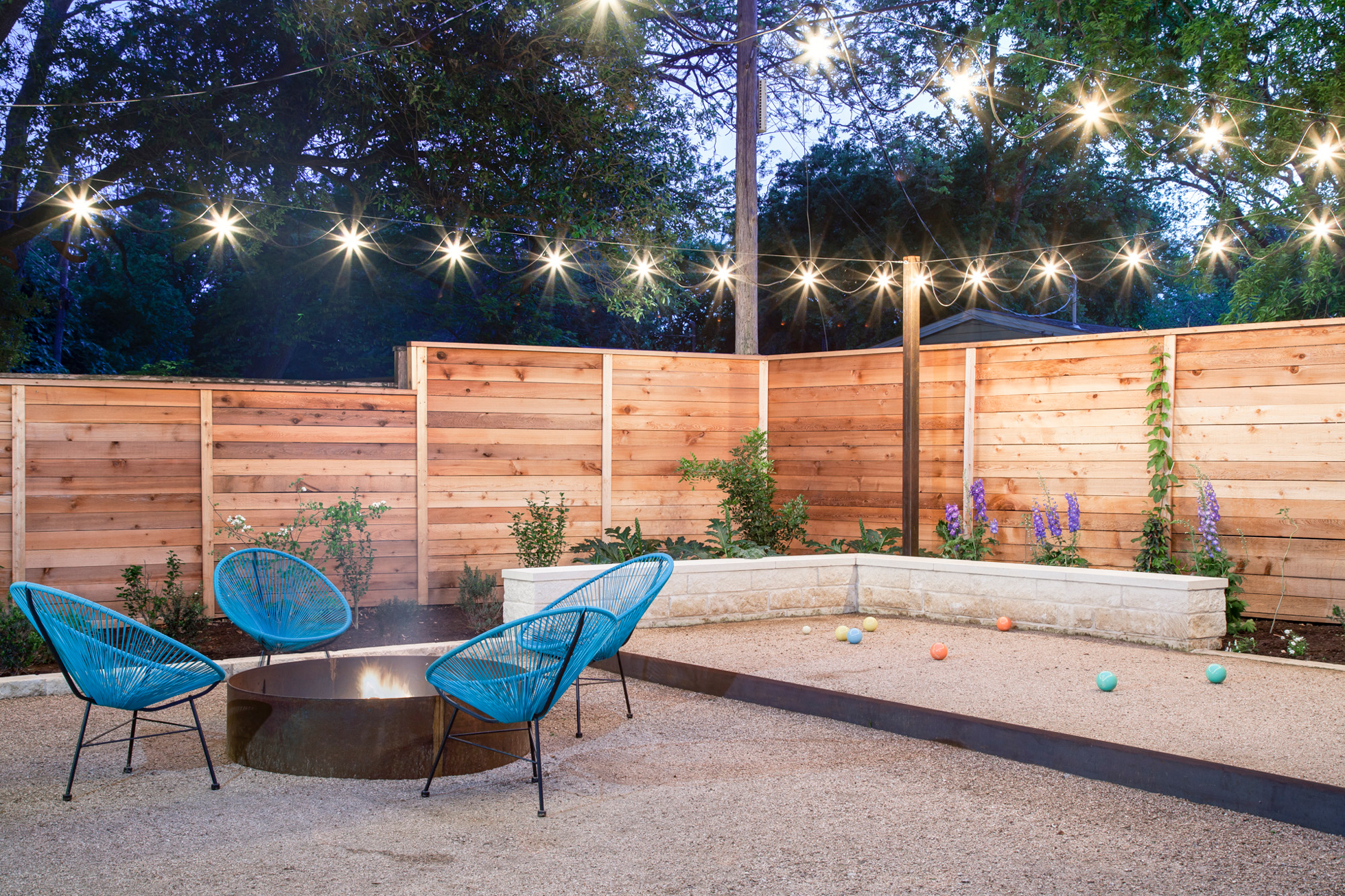 Backyard with firepit and bocce ball court
