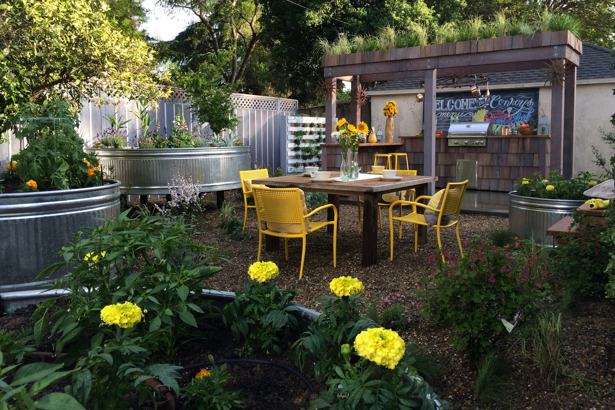 Backyard bar with dining table & stock tack vegetable garden