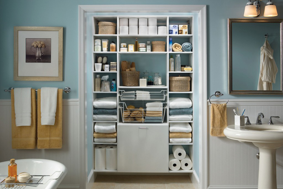 A hyper organized closet in a bathroom