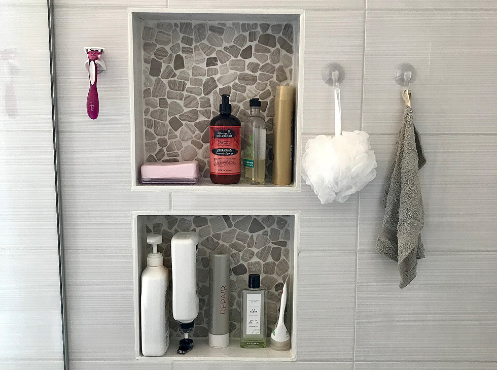 Two built-in shelves in a shower