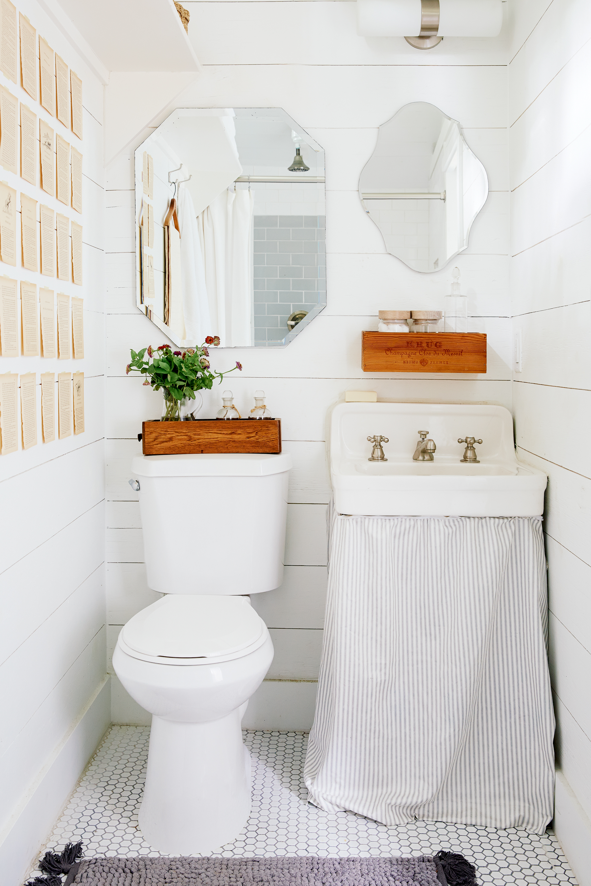 A cream-colored bathroom with a pedestal sink