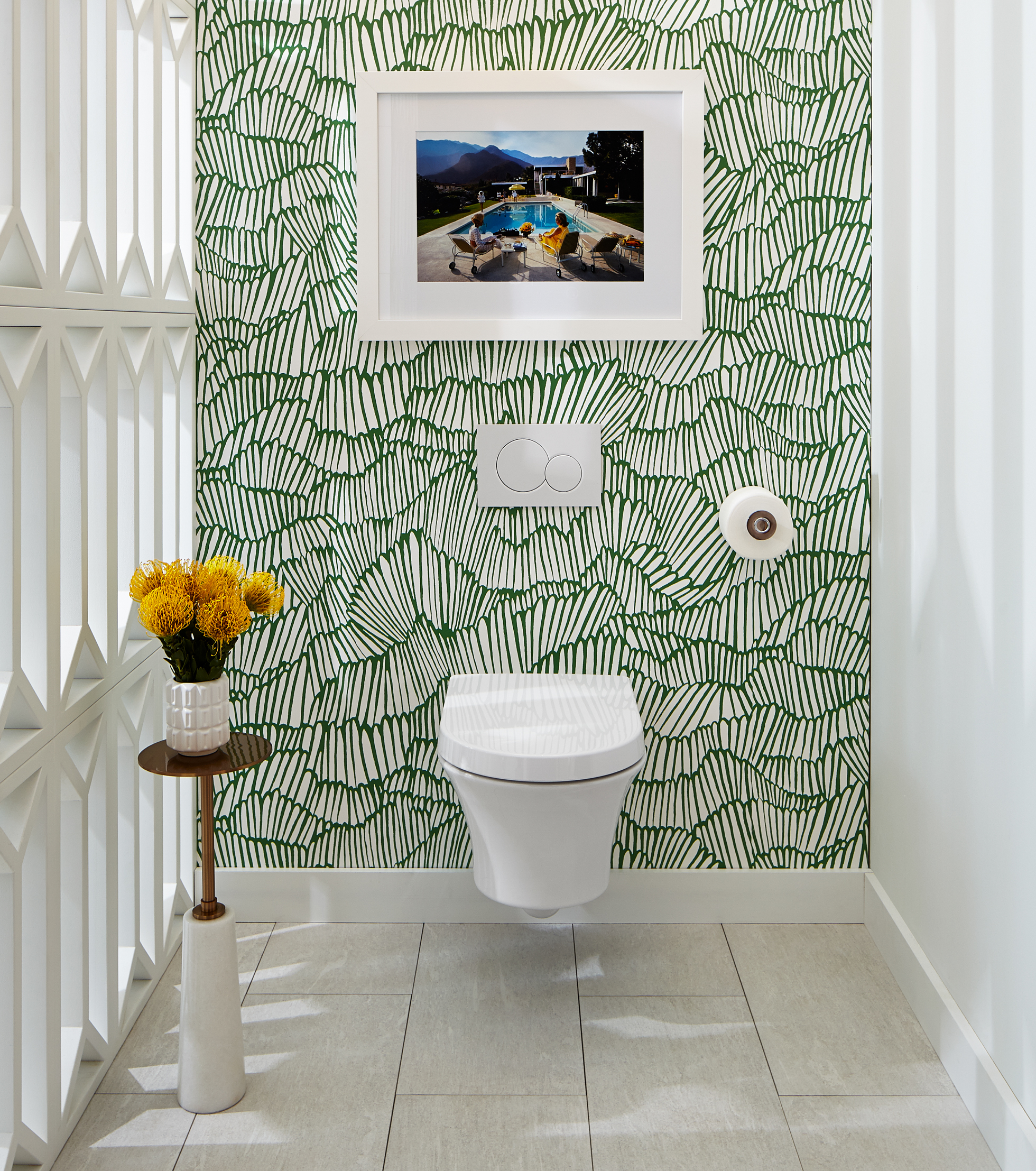 Bathroom with white/green wallpaper and wall-hung toilet