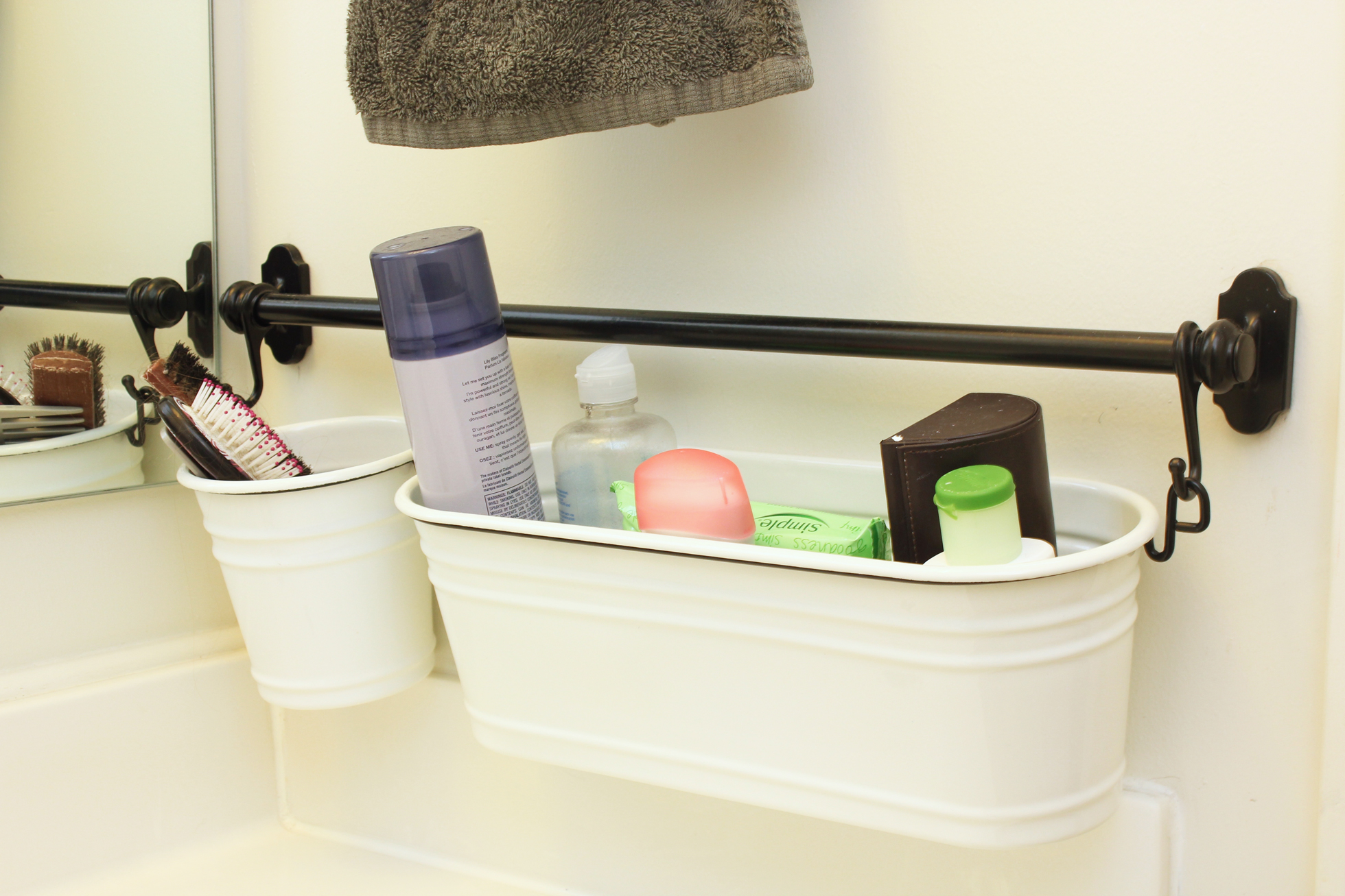 Cream-colored bins filled with toiletries