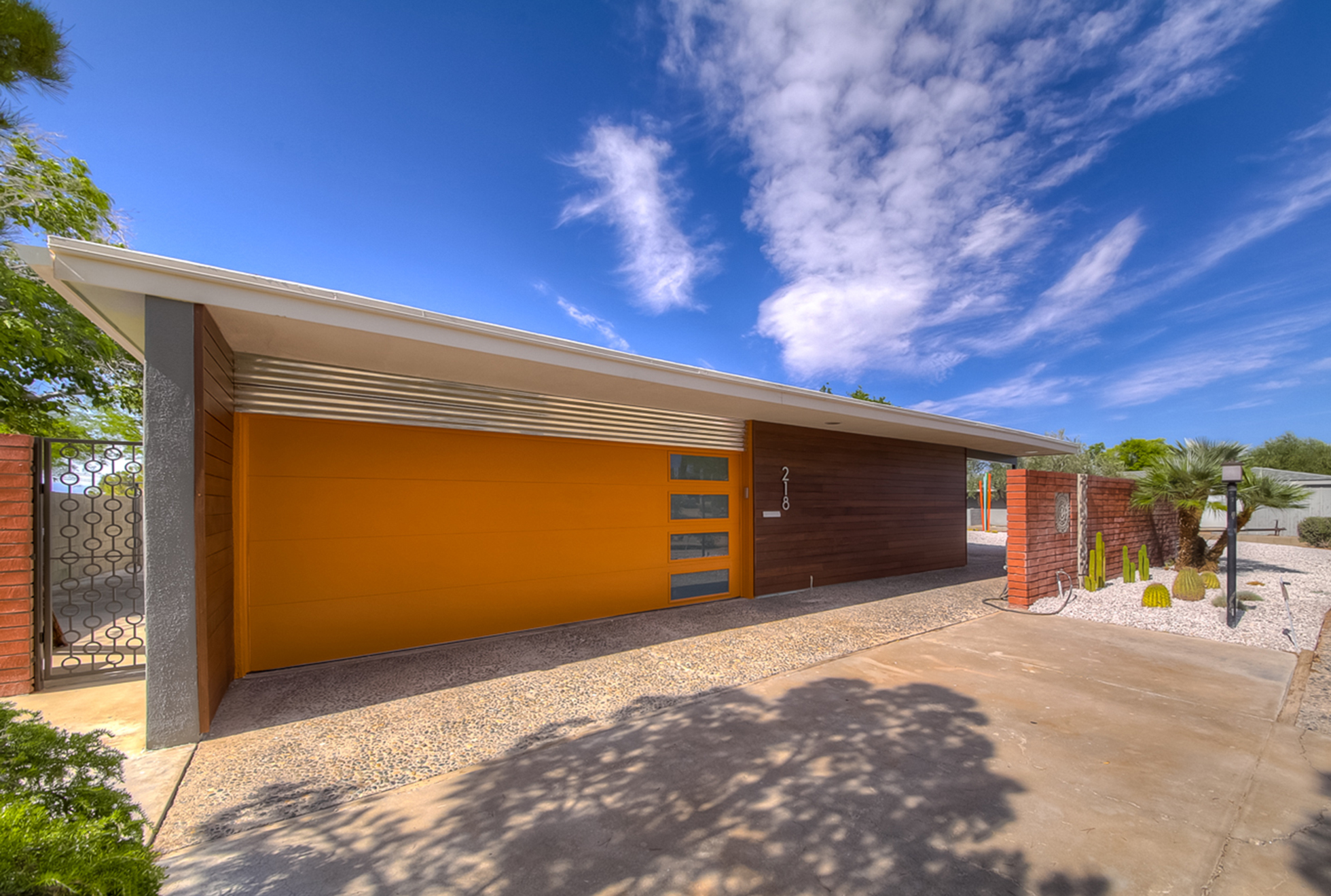 Orange garage door on mid-century modern California home