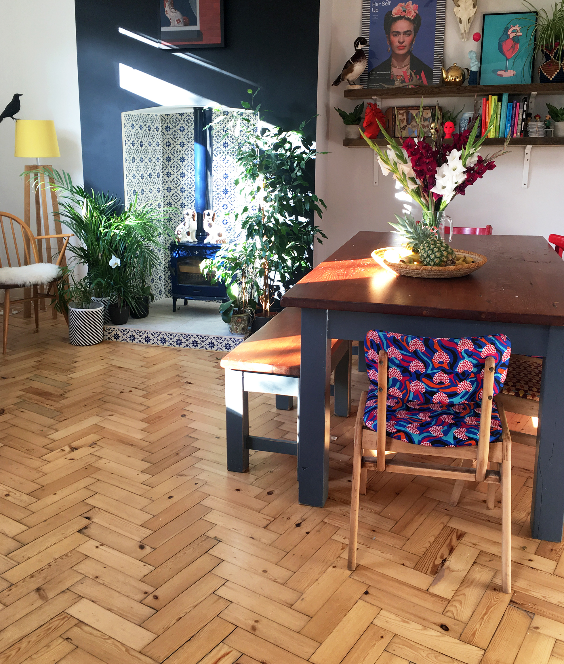 Dining area with herringbone flooring and tiled fireplace