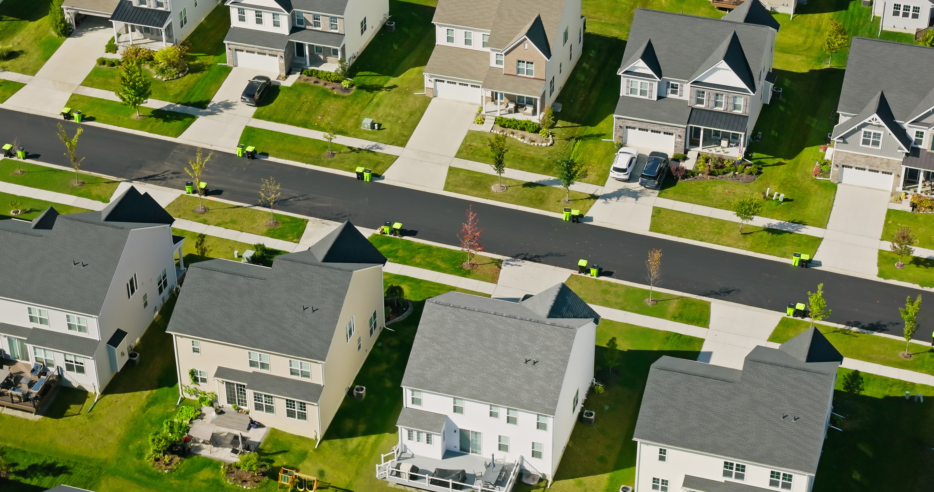 Aerial shot of suburban housing on a sunny day.