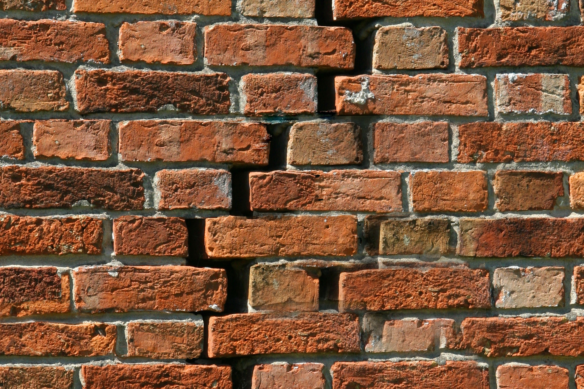 Brick exterior wall with damage