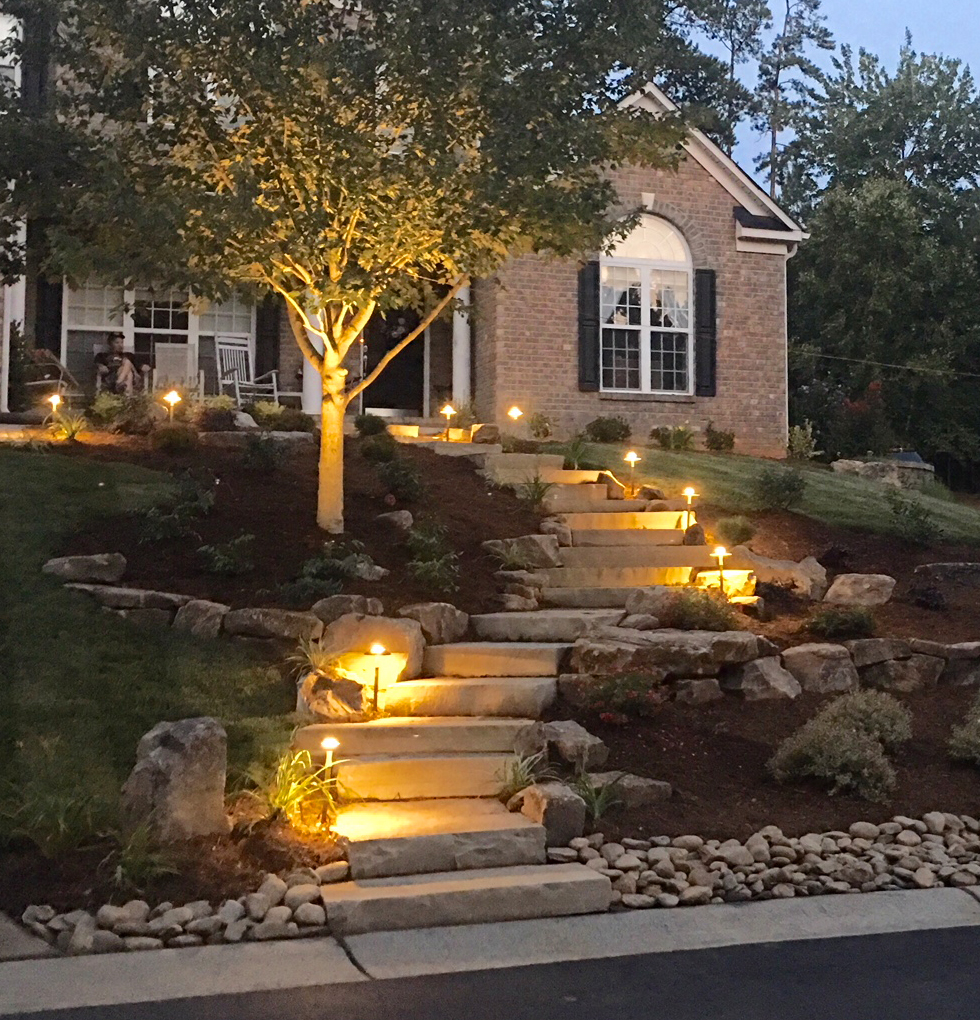 Outdoor stone steps lit with pathway lighting
