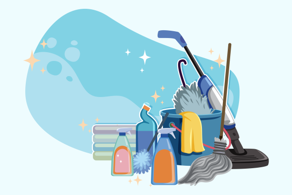 Cleaning supplies gathered together like a vacuum, cleaning agents, and a mop.