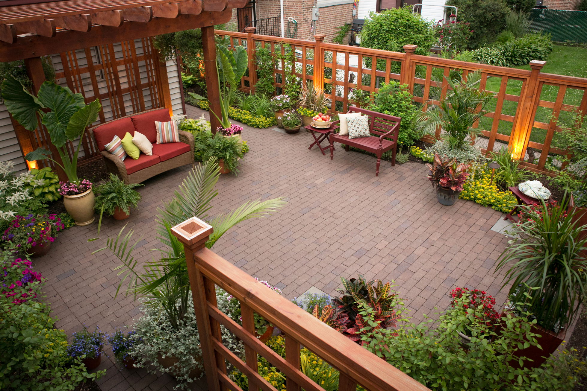 A backyard pergola and wood fence