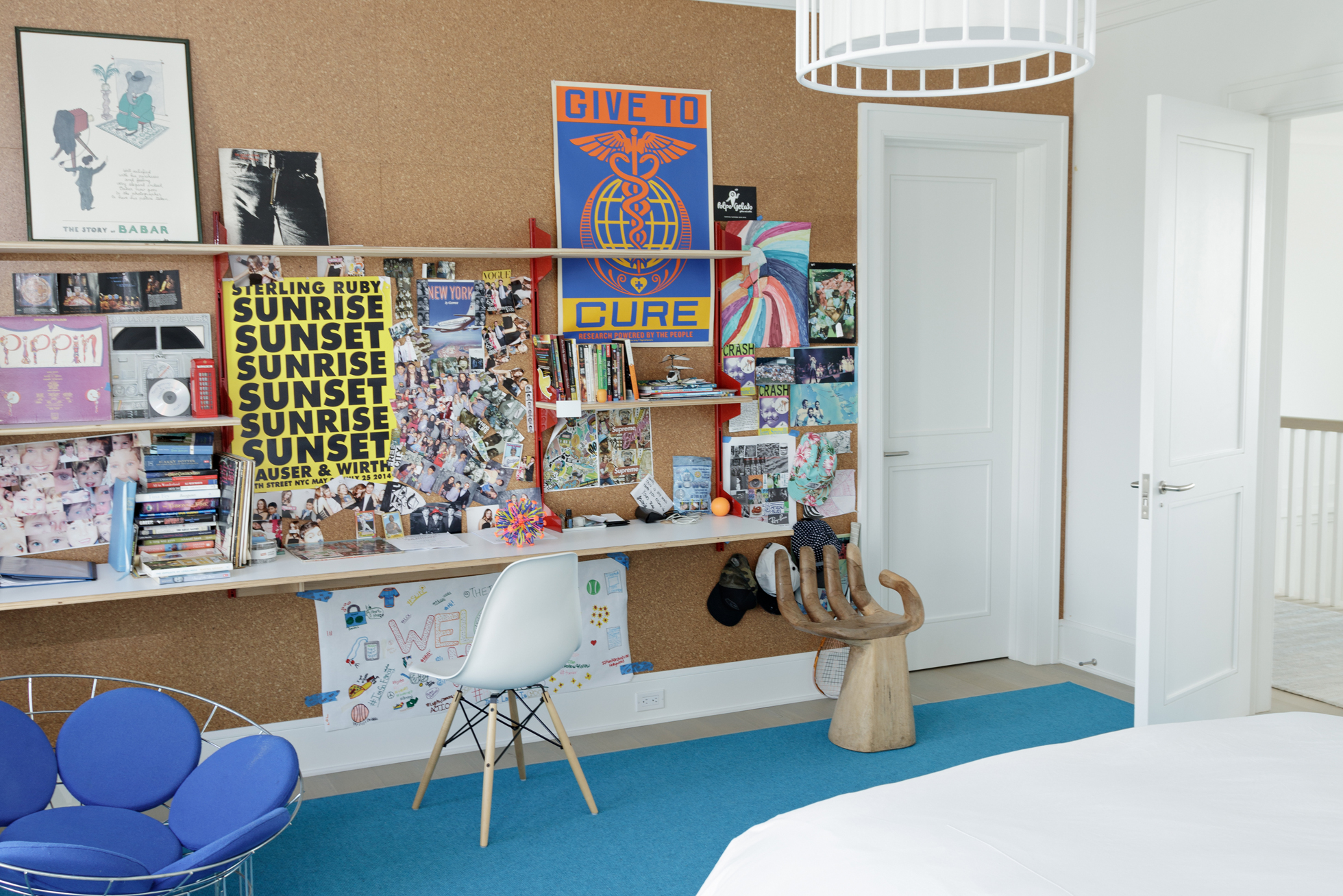 A corkboard wall in a bedroom