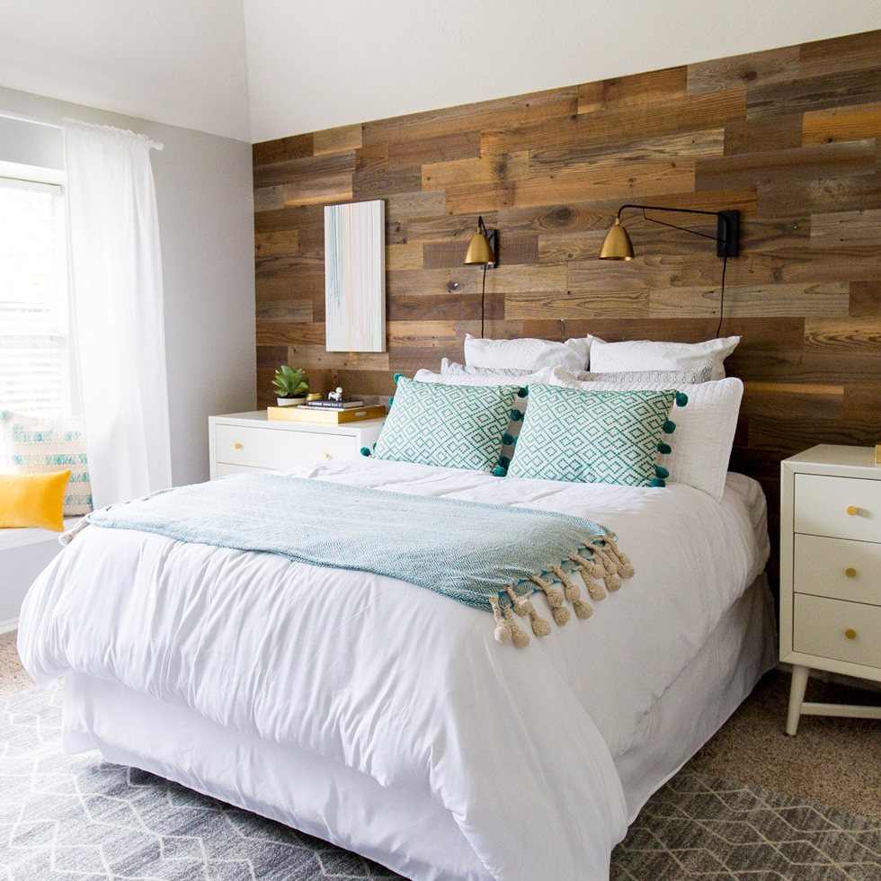 An after image a of a bright bedroom with DIY wood panel