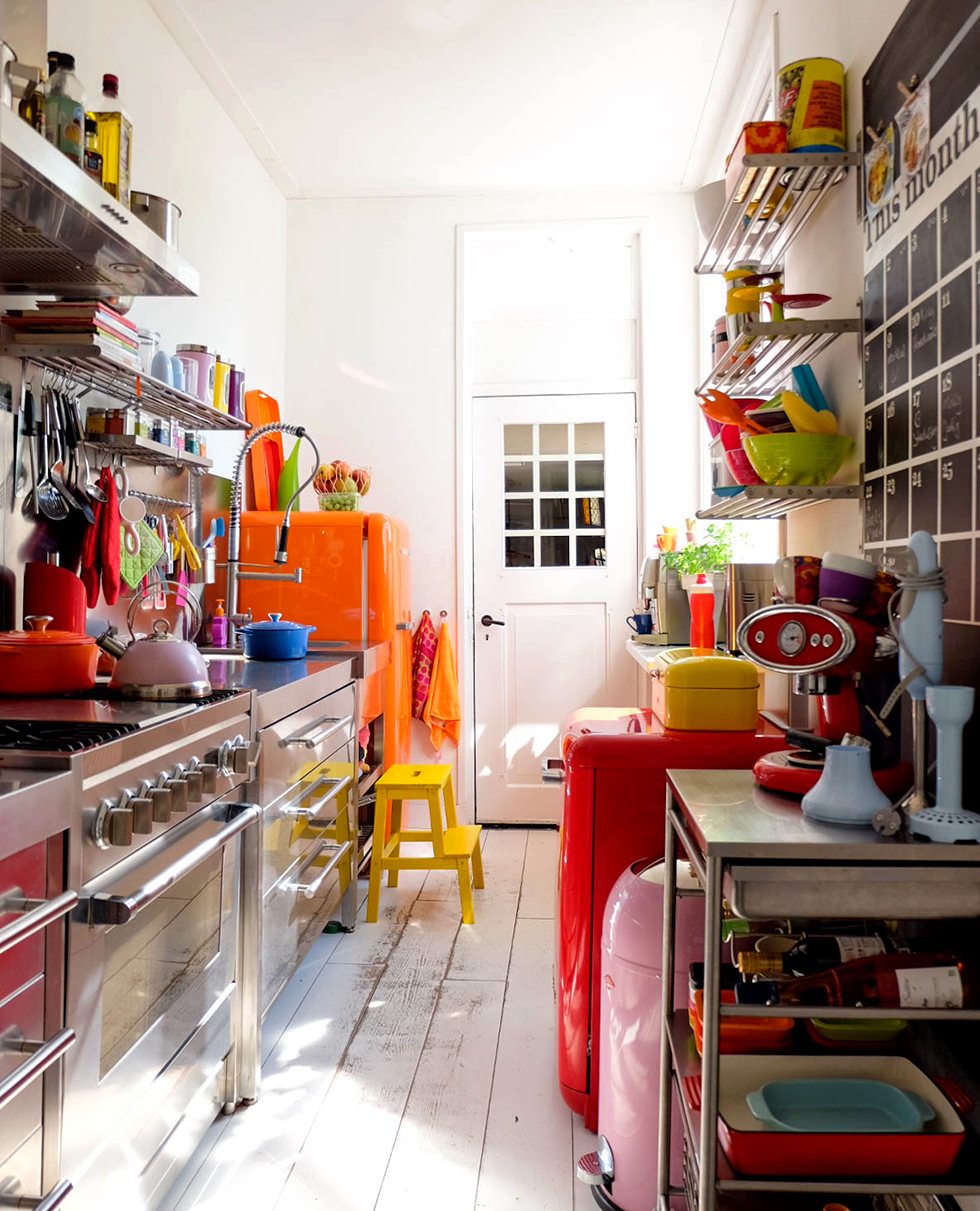 Organized kitchen stocked with brightly colored dishes