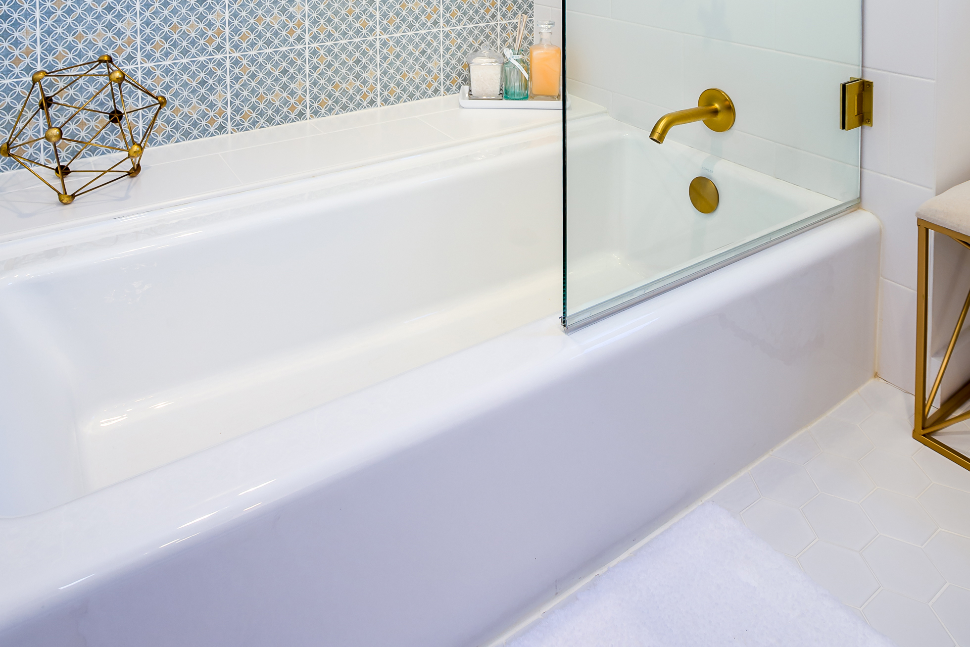 A white porcelain tub in a bathroom