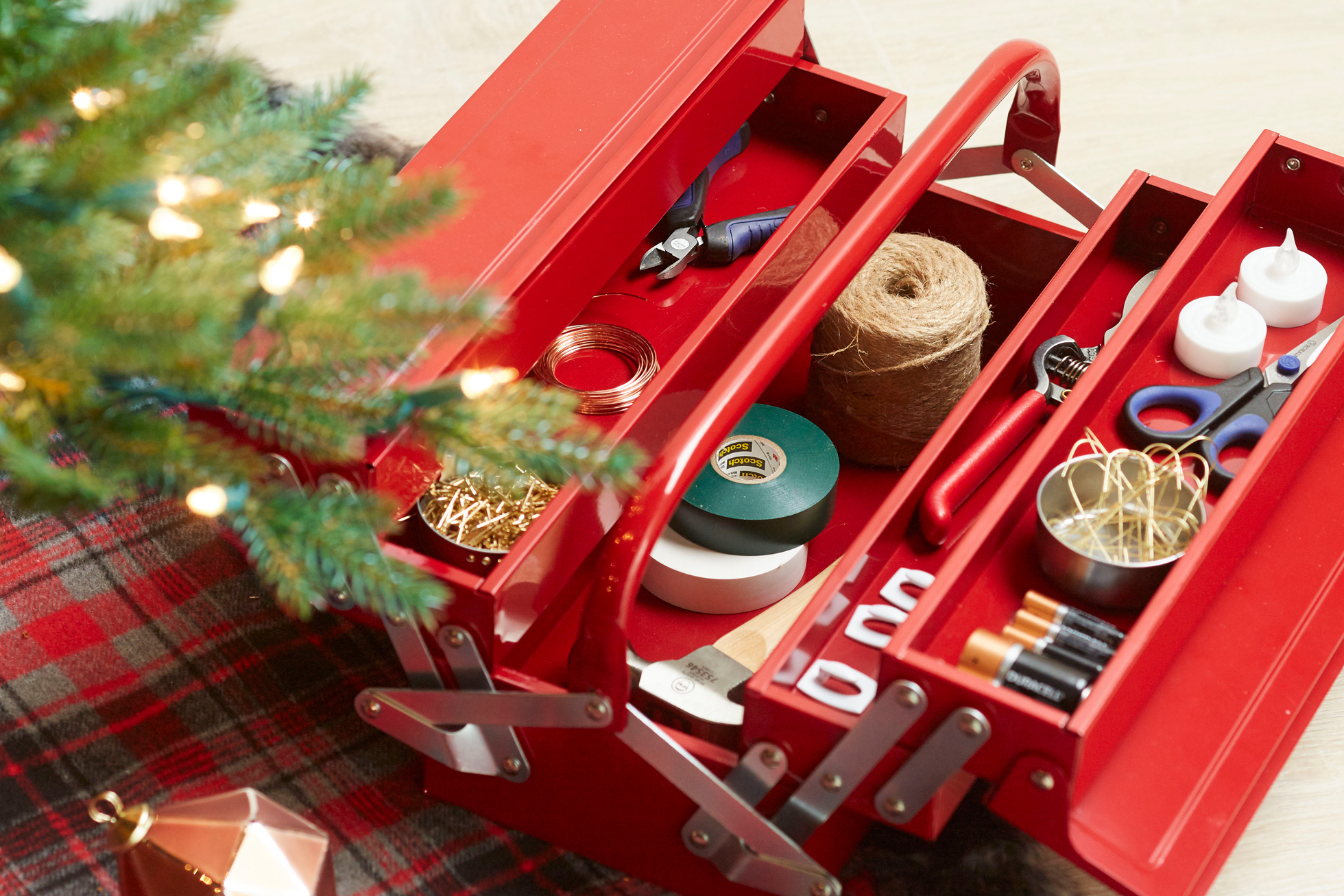A red toolbox with holiday-related items