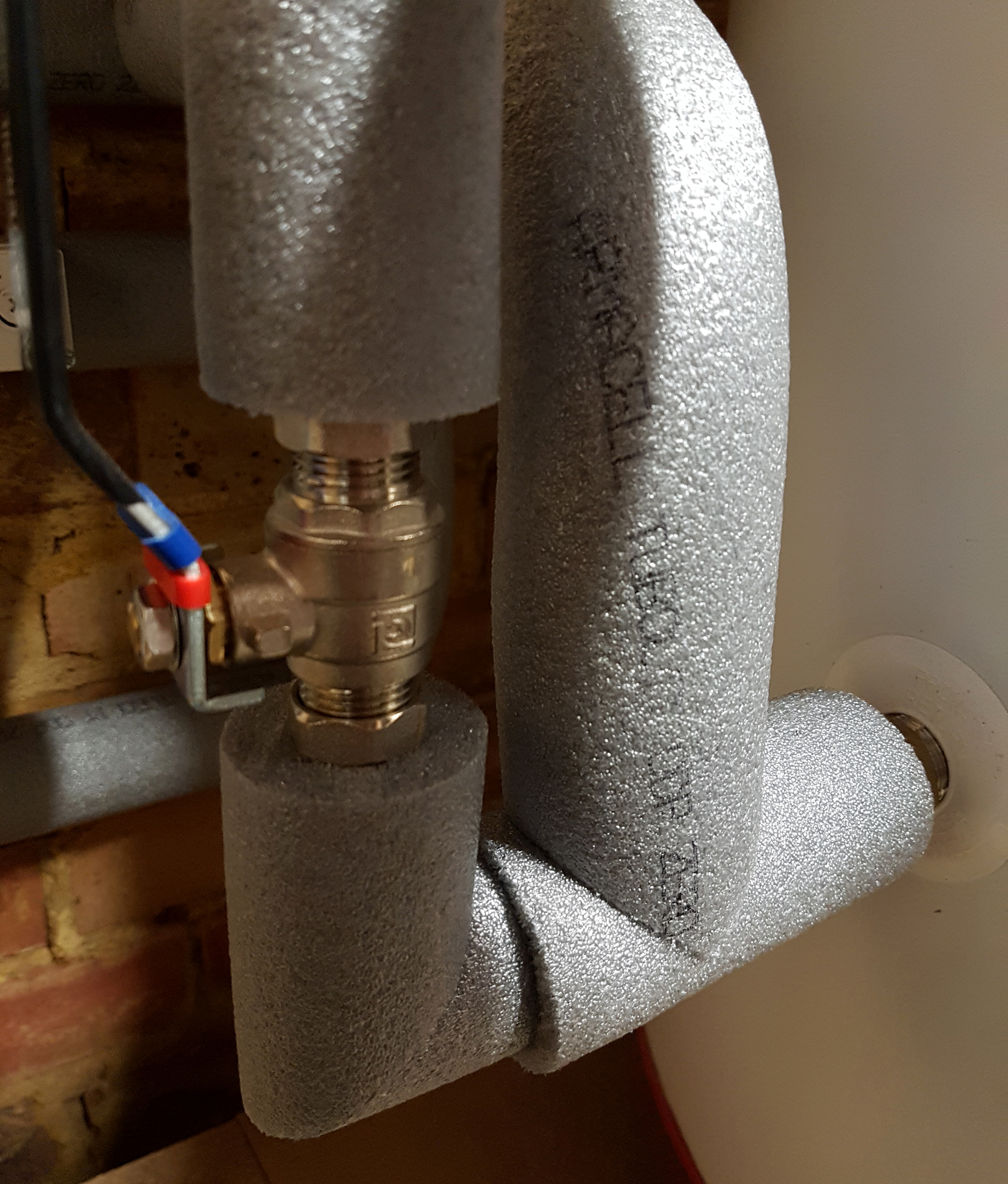 Gray foam pipe-sleeve insulation on pipe | DIY Insulation