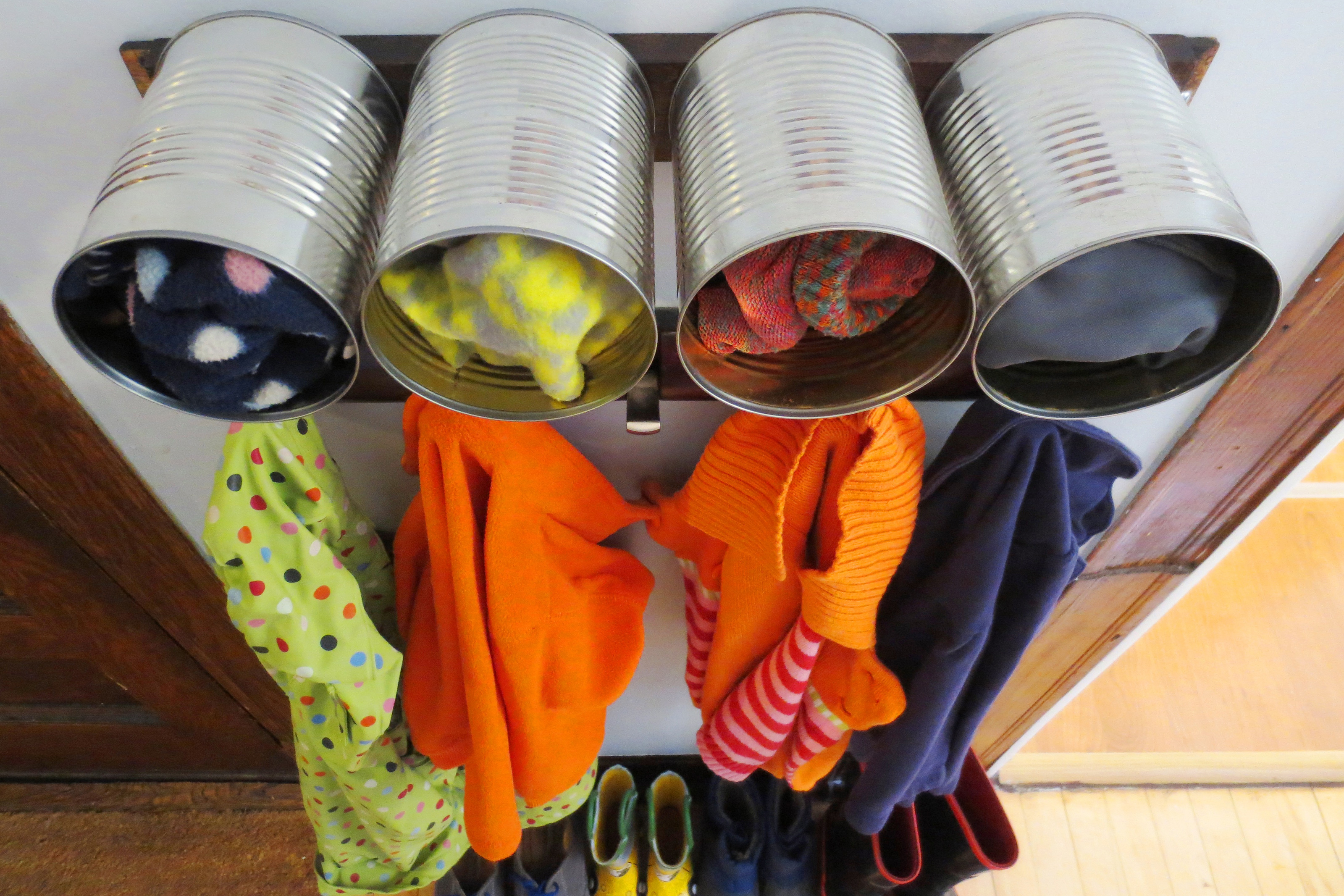Upcycled tin cans into mudroom storage