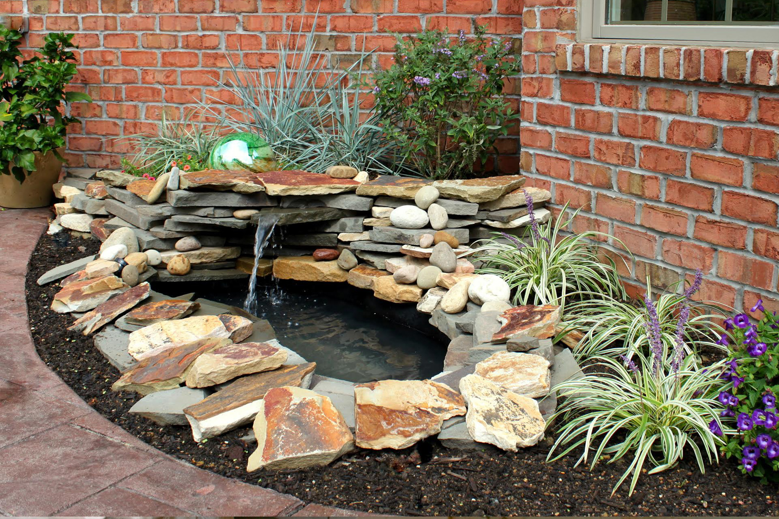 DIY waterfall and pond water feature in yard