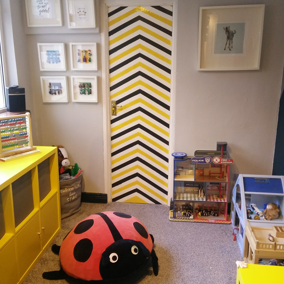 A black, white, and yellow chevron closet door