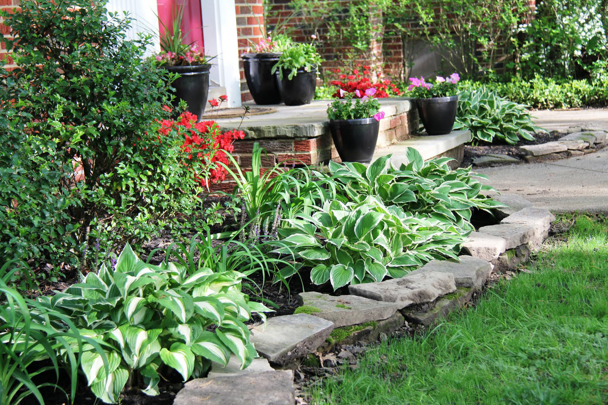 Rock wall around raised flower bed