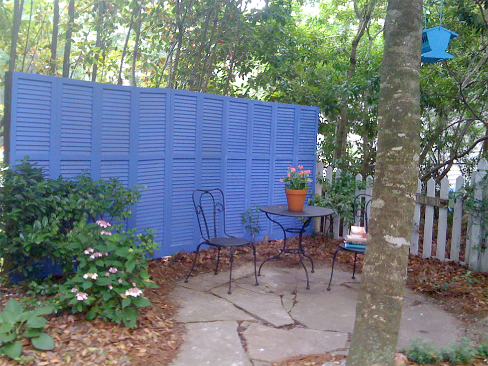 Blue shutter as fence in outdoor space