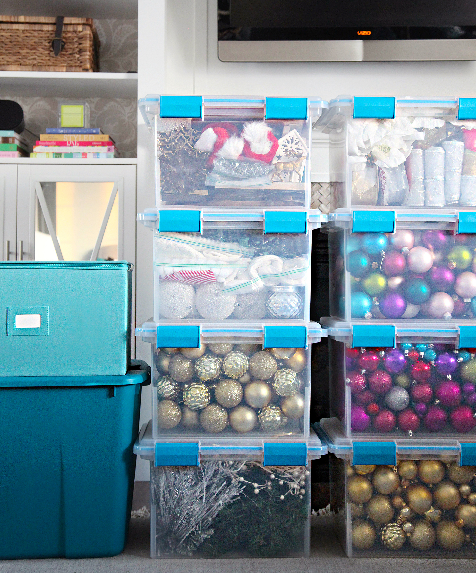 Large, clear plastic tubs full of Christmas decorations
