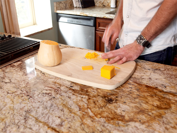 Chef using a cutting board in his home kitchen