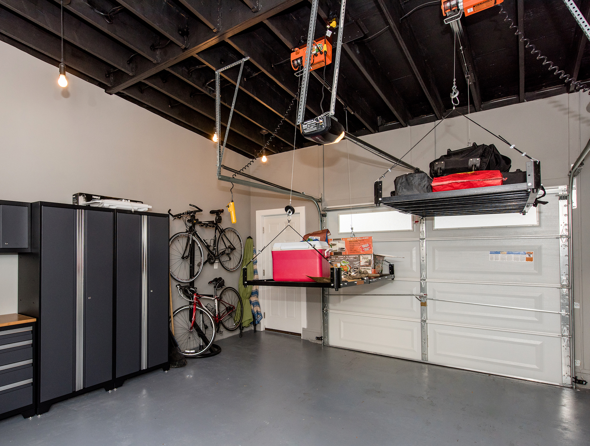 A garage outfitted with a pulley storage system