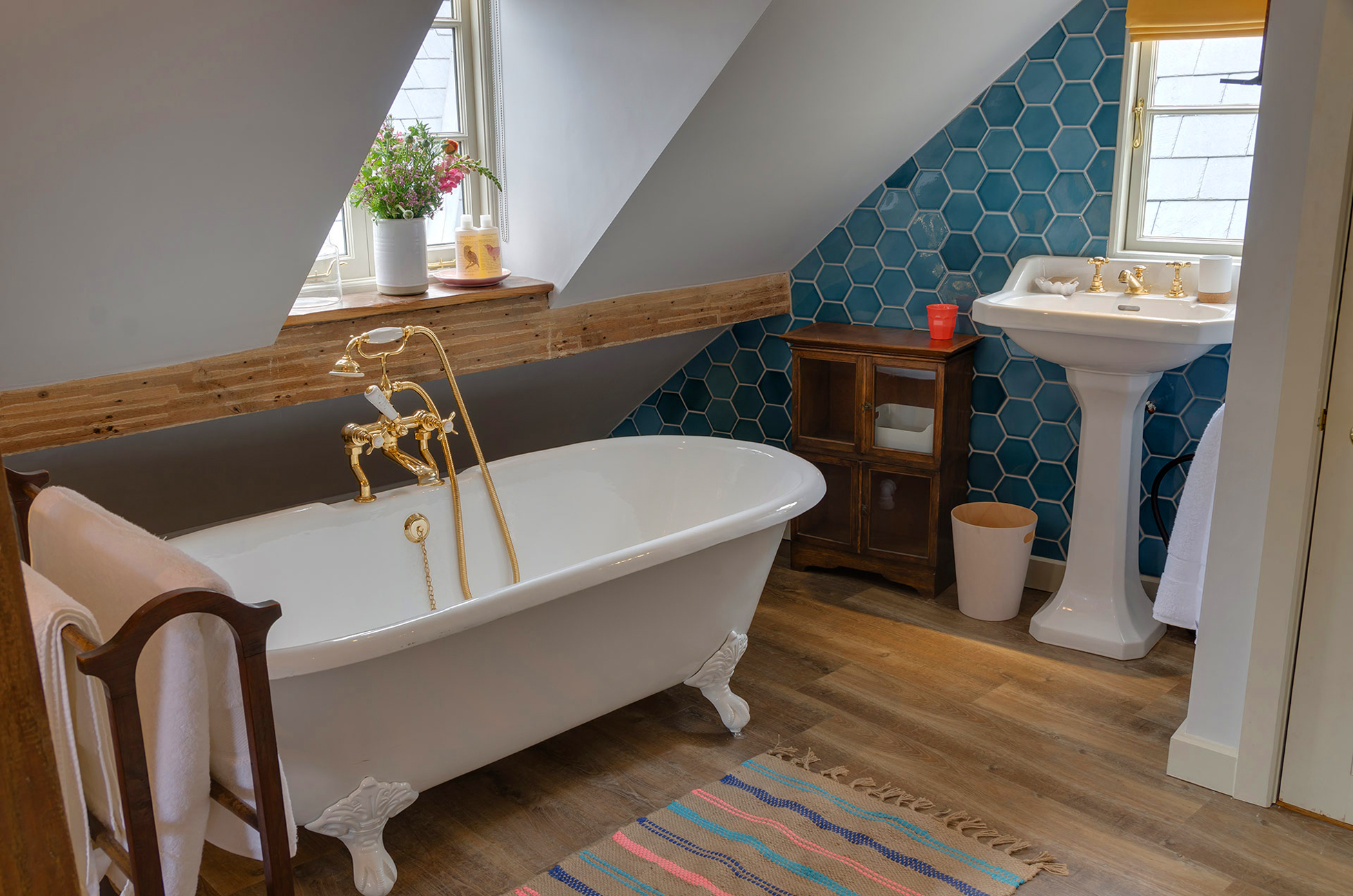 Renovated attic bathroom with hex tile wall