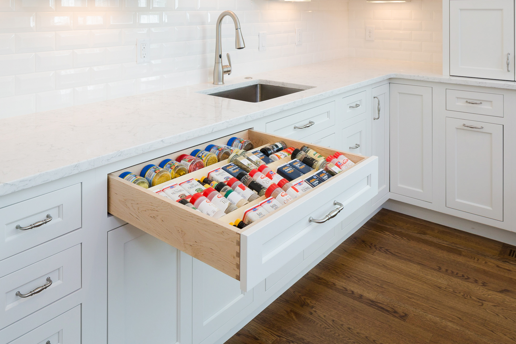 Spice drawer in a white kitchen
